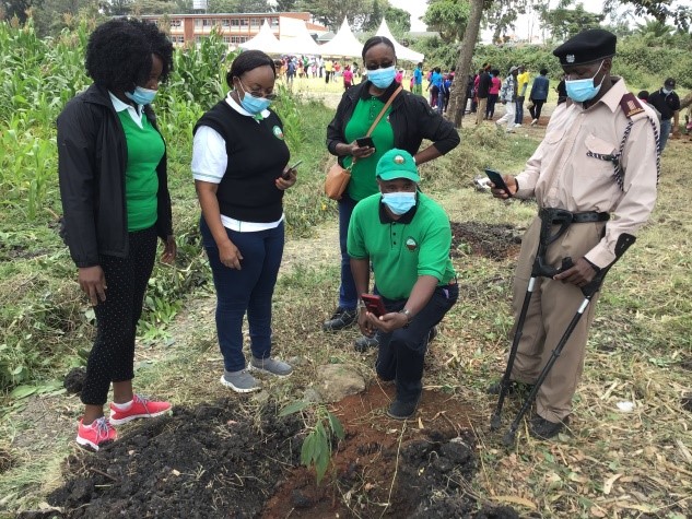 Dr Jane Njuguna and the KEFRI team demonstrating how to document tree planting using the KEFRIApp
